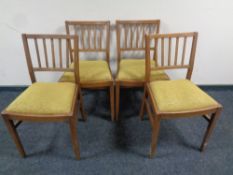 A set of mid century rail backed kitchen chairs