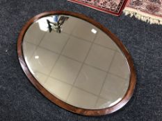 An Edwardian mahogany framed oval mirror