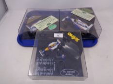 Three Onyx Formula 1 models in plastic display cases to include Williams Renault Ayrton Senna,