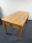 An Edwardian oak office table fitted with two drawers, width 76 cm length 153 cm.