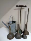 A galvanised British Rail watering can together with five vintage poss sticks