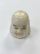 A Japanese carved bone netsuke - Head of Buddha