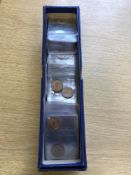 A box containing a quantity of mid 20'th Century copper coins - British Farthings and Pennies.