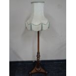 A 19th century brass inlaid rosewood pole screen stand converted to a standard lamp