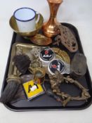 A tray of antique and later cast iron and brass, vintage car and motorcycle badges, money box,