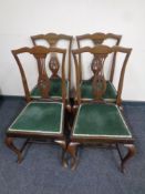 A set of four nineteenth century mahogany dining chairs on cabriole legs
