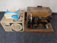 A twentieth century Jones Family CS hand sewing machine in case together with an Sawyers slide