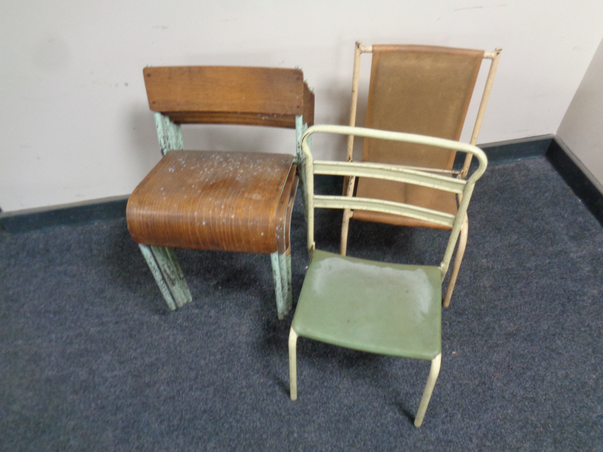 A set of four metal and bent plywood stacking nursery chairs together with two further metal framed