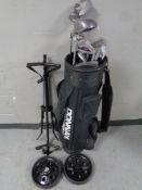 A set of Donnay golf clubs in bag together with a folding golf trolley