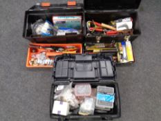 Three plastic tool boxes containing fixings, socket sets, hand tools,