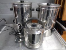 Two stainless steel hot water urns together with a further electric kettle