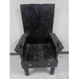 A rustic throne chair