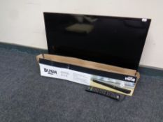 A JVC Smart 32 inch LCD TV with remote together with a boxed Bush small screen sound bar