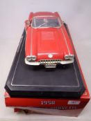 A Solido 1:12 scale die cast 1958 Chevrolet Corvette on plinth,