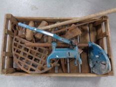 A vintage wooden tray containing assorted hand tools,