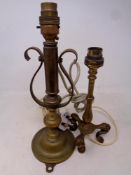 An antique brass ships candlestick together with a further brass railway style lamp