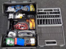A concertina box containing electrical test equipment, wires, cased socket set.