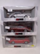 Three UT Models 1:18 die cast cars - Porsche 911 GT II,