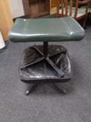 Two twentieth century leather footstools on metal legs