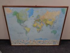 A Maps International world map, framed.