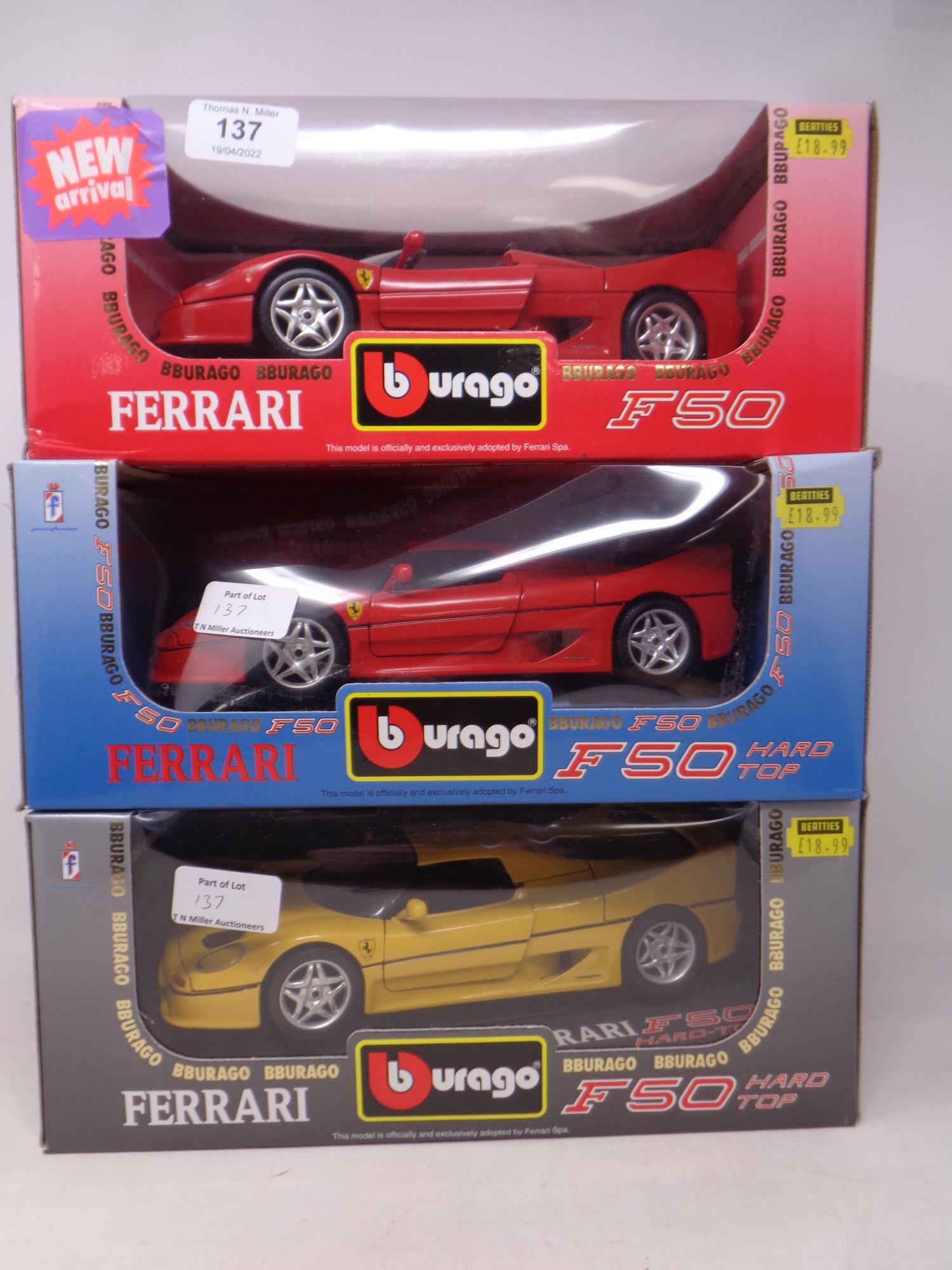 Three Burago 1:18 die cast cars - Ferrari F50 and two Ferrari F50 hard top,