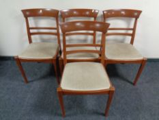 A set of four late twentieth century dining chairs in teak finish