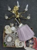 A brass seven way chandelier with shades together with a box of light fittings,
