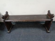 An antique pine bench (made from a church pew), length 132 cm.