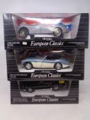 Three Ertl European Classics 1:18 scale die cast vehicles to include Mercedes Benz 190 SL Roadster,