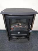 A Dimplex electric fire in the form of a log stove together with a slate hearth