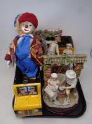 A tray of two Leonardo collection figurines, two W M Morrison delivery van tins,