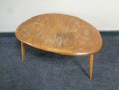An Ercol elm and beech pebble table