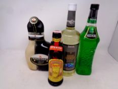 Four bottles of alcohol to include Kahlua, Midori,