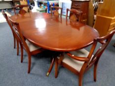 A twentieth century G-plan oval extending dining table, six chairs, in a mahogany finish,