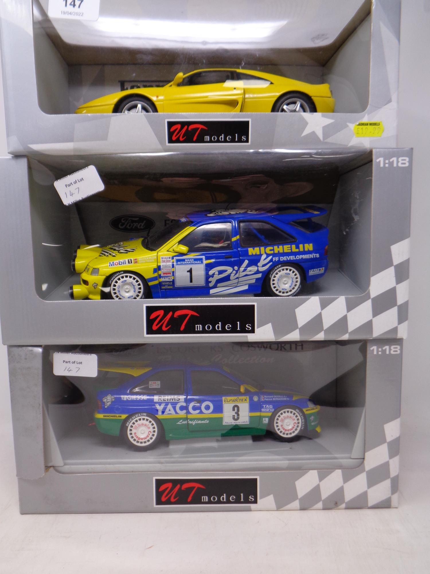 Three UT Models 1:18 die cast cars - Ferrari F 355 Berlinetta and two Escort RS Cosworth Racing