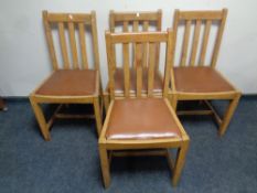 A set of four twentieth century rail backed chairs