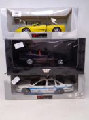 Three UT Models 1:18 die cast cars - Ferrari F 355 Spider, Chevrolet Caprice, BMW 3 series,