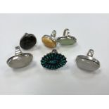 A group of six large silver dress rings set with gemstones