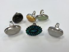 A group of six large silver dress rings set with gemstones