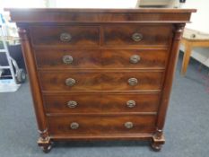 A Victorian mahogany six drawer lobby chest with column supports