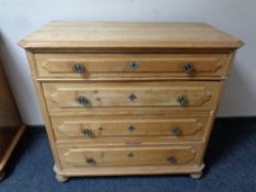 An antique pine four drawer chest