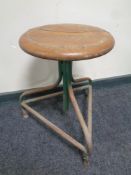 A circular adjustable industrial machinist stool