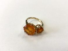 A 9ct gold dress ring set with Buriti Fire Opals (4.