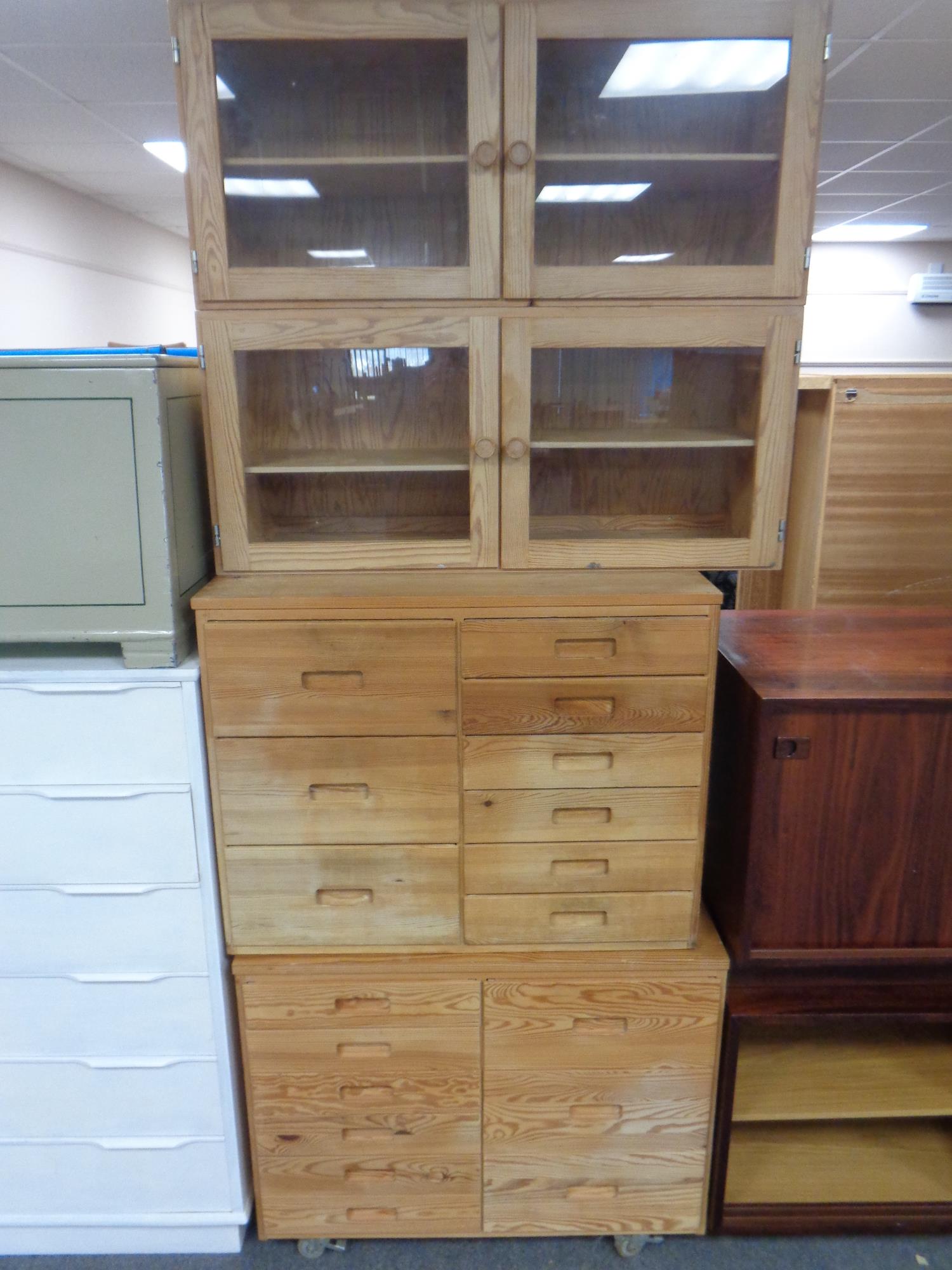 Two Swedish pine nine drawer chests,