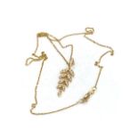 An 18ct yellow gold diamond leaf style pendant and chain