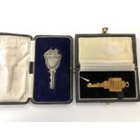 A cased silver key and one other key awarded to the Smith family