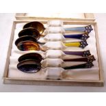 A boxed set of six Norwegian silver and enamel teaspoons