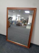 A contemporary overmantel in an oak effect frame