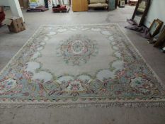 A large Chinese carpet, on green ground,