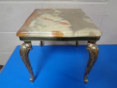 An onyx topped occasional table on gilt metal legs